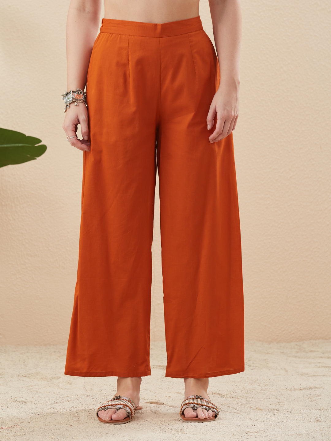 Person wearing orange wide-leg pants against a beige background Orange Cotton Embroidered Kurta with Palazzo Set for Women