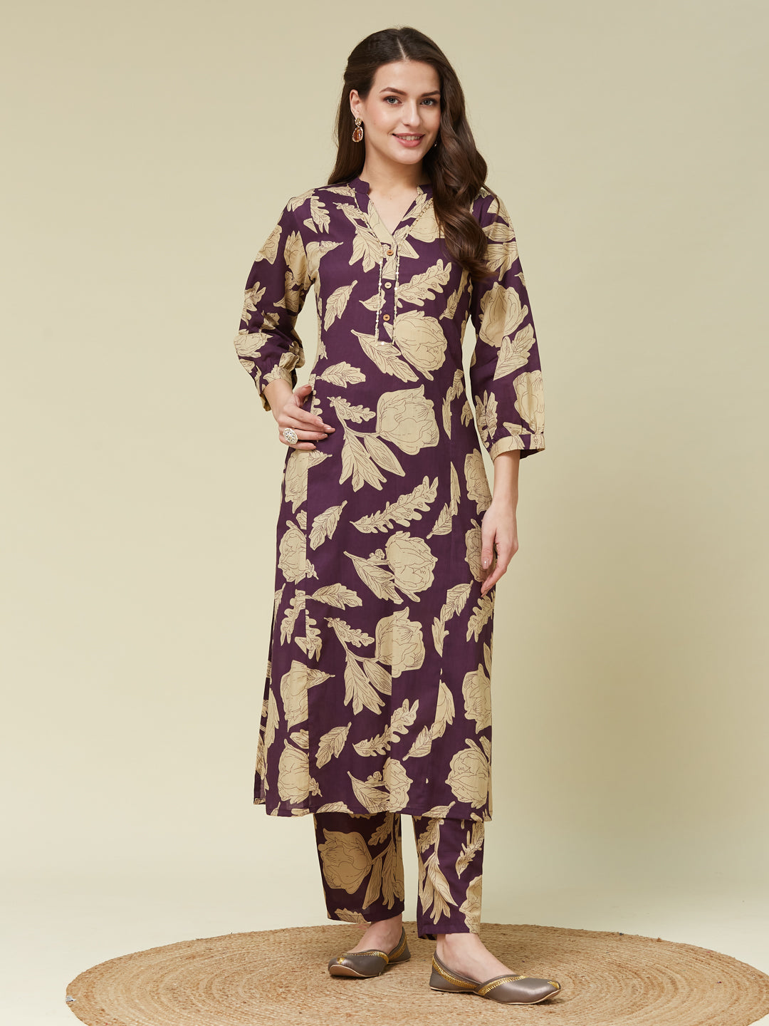 A woman modeling a wine cotton printed handwork co-ord set with a floral pattern. Wine Cotton Printed Handwork Co Ord Set | Colors of Earth