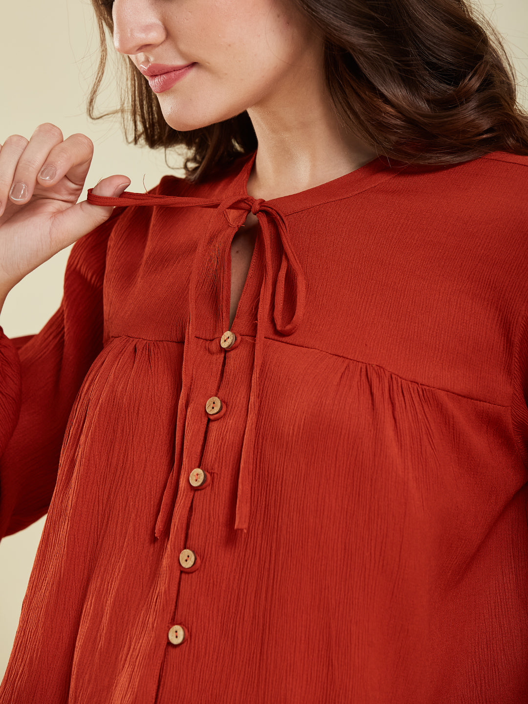 Rust Crinkled Peplum Top with Tie-Up Neck